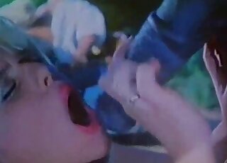 Sexy zoophile lady greedily sucking on a brown horse's huge cock