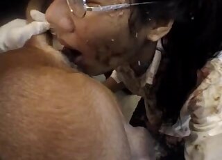 Nerdy babe gets covered in poo while licking dirty dog asshole