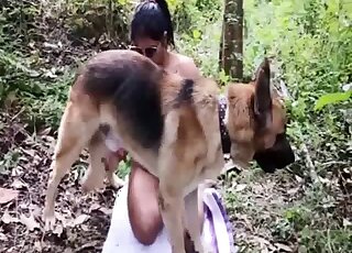 German Shepherd lets Latina lady do oral work on his shaft outdoors