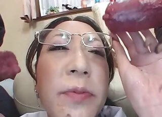 Asian nerd in glasses getting double-throated by two meaty dog dicks