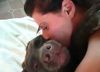 Kinky mature takes her dog in bed and gives the beastl her pussy